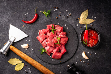 Raw beef meat and ingredients for cooking