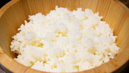 Japanese rice served in a bamboo bowl, with soft lighting highlighting the plump, moist rice grains, steamed Japanese rice, rice in bamboo bowl