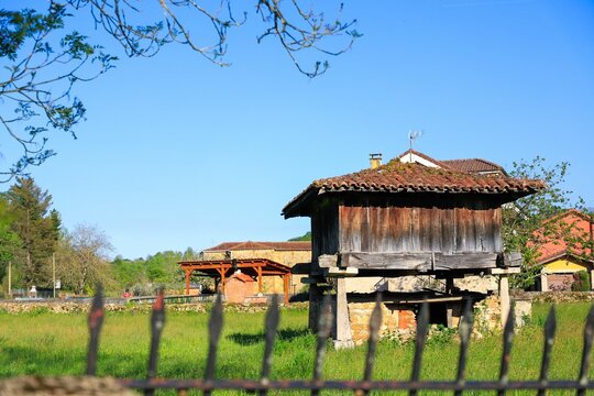 Traditional Spanish horreo in rural landscape.