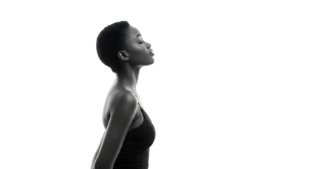 Profile portrait of a confident woman against a minimalist background, showcasing strength and elegance in her demeanor