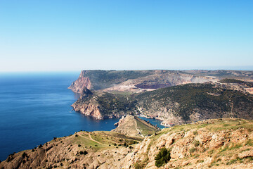 Plakat Seascape. View of the coast and the Black Sea in the sunlight. Crimea, Crimean mountains