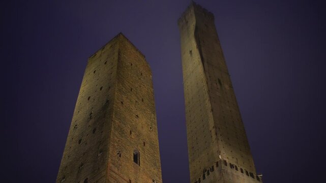Two Towers, both of them leaning, are symbol of Bologna, Italy, and most prominent of Towers of Bologna. Taller one is called Asinelli while smaller but more leaning tower is called Garisenda.