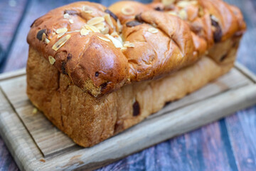  Brioche bread.  Home made easter butter  covered with sugar  on wooden background.