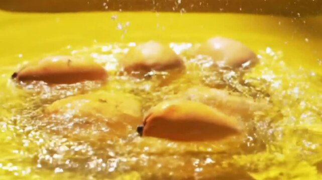 Mango falls into the water, there is a splash of freshness, then mango juice is poured into a glass with copy space next to it. Short video suitable for video elements about drinks. Generative AI.