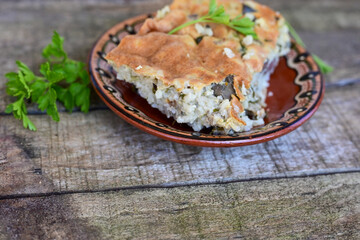  Rice shepherd's pie.   Rice and  Lamb meat  Casserole  with   parmesan cheese and garlic on wooden rustic bakcgound.  Traditional Bulgarian dish with Lamb and rice