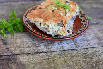  Rice shepherd's pie.   Rice and  Lamb meat  Casserole  with   parmesan cheese and garlic on wooden rustic bakcgound.  Traditional Bulgarian dish with Lamb and rice