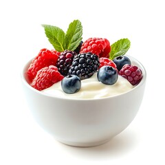 A white bowl filled with yogurt and topped with fresh mixed berries fruit