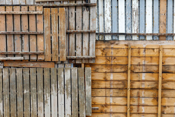 A collage of wood panels with a mix of brown and white