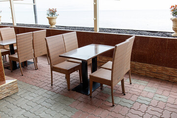 A patio with a table and chairs outside