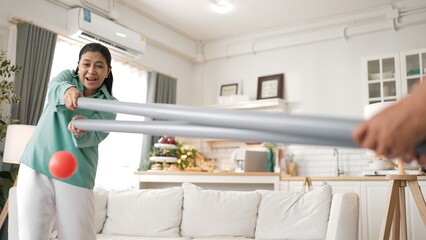 Grandmother holding pipe and carrying ball rolling game for exercise to improve eye, hand coordination or enhance focus and concentration. Elder couple providing stress relieve. Healthcare. Myrmidon.