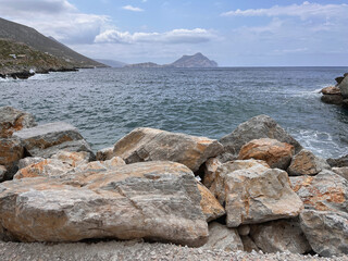 Rocky Shoreline of Amorgos Island, Greece – A Scenic Coastal View with Crystal Blue Aegean Sea,...