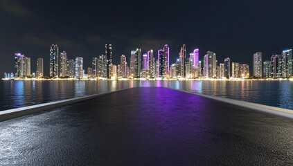 Obraz premium Urban skyline at night, reflecting on water, empty road leading to city