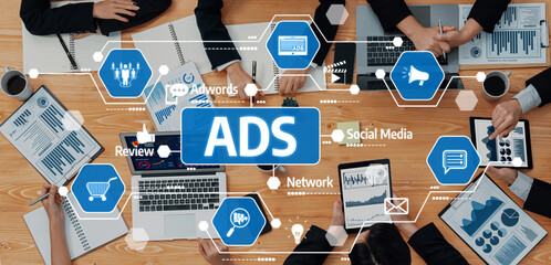 A dynamic meeting scene highlighting collaborative advertising strategies with data visualizations, digital marketing elements, and tools for effective communication. Amity