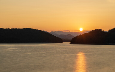 summer sunset over the lake Pertusillo, Val d'Agri, Basilicata, Italy