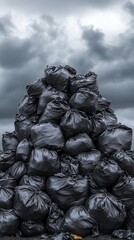 Pile of black plastic garbage bags in a landfill