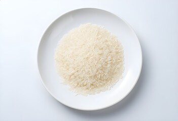 Raw white rice grains served on a clean white plate isolated on white background. Uncooked white rice. Studio shot of dry white rice in clean composition. Cooking ingredient. Asian food. Bowl of rice