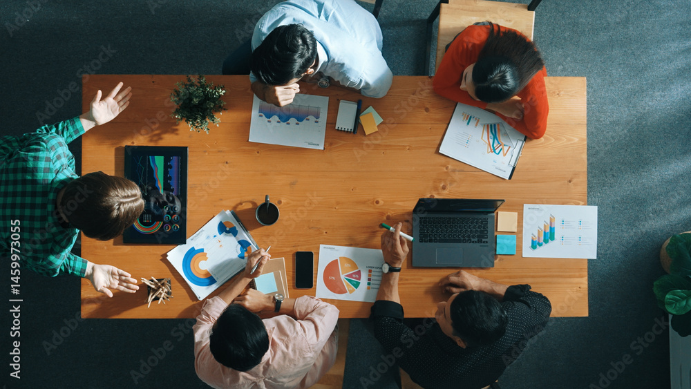 Poster top down view of manager holds tablet display increasing sales and placed on meeting table. group of