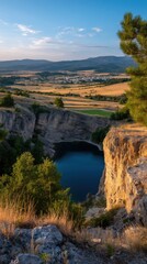 Dramatic Canyon Overlook with Blue Lake, Mountains, and Distant Town