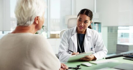 Senior woman, doctor and consultation with clipboard for healthcare, writing or checkup. Checklist, talking and patient in medical clinic for test results, insurance application and explain symptoms - Powered by Adobe