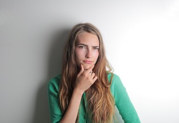 young woman with thinking expression