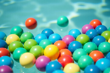 Fototapeta premium A group of colored balls floating on the sea surface.