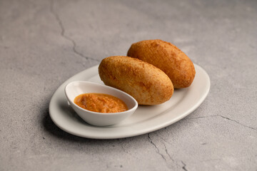 Delicious croquettes with sauce