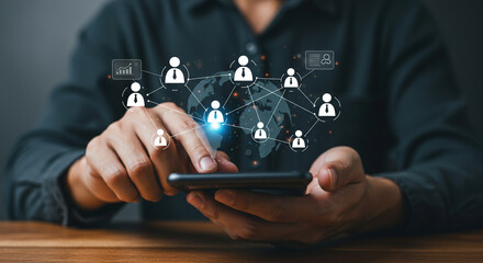 Man using smartphone displaying a social network connection interface with global connections business, data