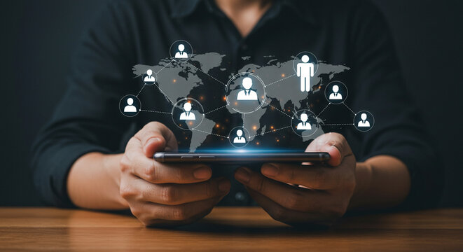 Person holding phone displaying global network connections with world map overlayed on screen business, data