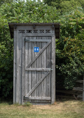A wooden outhouse