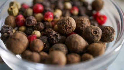 Black peppercorns, black and red peppercorns, close-up, spices. Cooking concept.