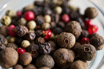 Black peppercorns, black and red peppercorns, close-up, spices. Cooking concept.