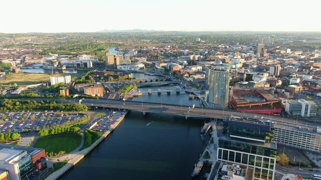 Aerial view on Lagan river and buildings in City centre of Belfast Northern Ireland. Drone photo, high angle view of town - Powered by Adobe