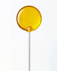 An orange lollipop. Packaging for lollipops.