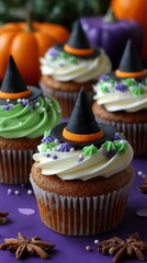 Halloween cupcakes with witch hats and decorative toppings for a spooky celebration
