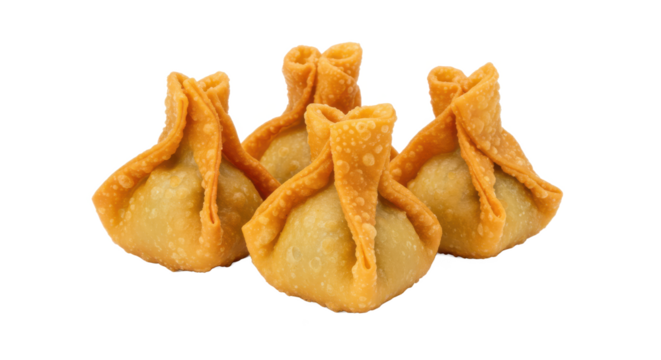 A close up shot of several modaks arranged together on a plain surface with a blurry background behind them