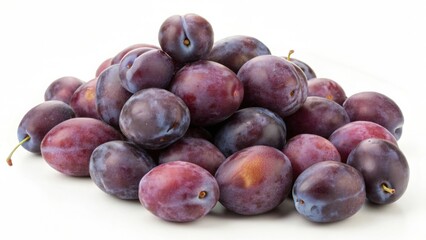 Obraz premium Plums stacked in a vibrant display on a clean white background their rich color and natural beauty