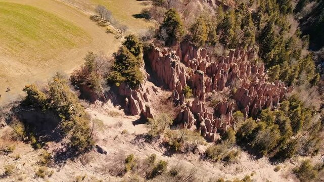 Aerial top view natural Earth Pyramids in Renon, Ritten, South Tyrol, Italy.