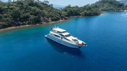 Luxurious White Yacht Anchored in a Tranquil Bay 