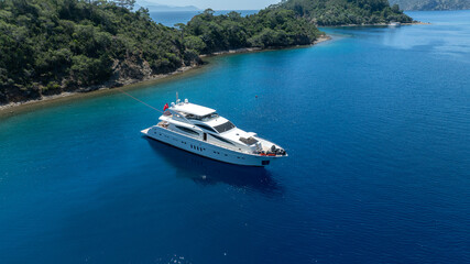Luxurious White Yacht Anchored in a Tranquil Bay 