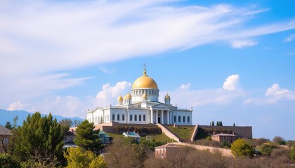 Fototapeta premium Grand church atop hill under a vibrant blue sky