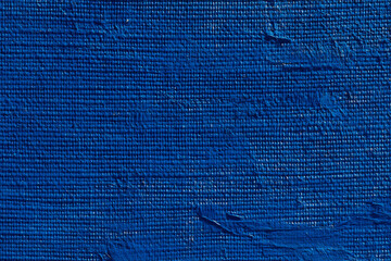 Close-up of blue painted canvas texture showing brush strokes,  thick paint, and woven canvas weave Ideal for background or artistic design