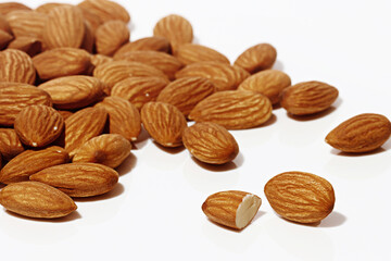 Several Fresh Almonds on white background