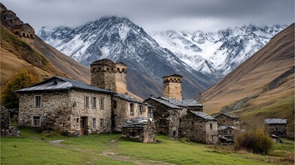 Ancient stone village nestled among snowcapped mountains