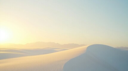 Soft light illuminates a vast expanse of white sand dunes.
