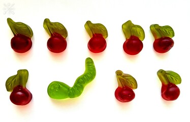candies on a white background.
close-up set of eight jelly candies in the form of a red cherry with...