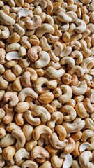 Tightly Packed Raw Cashews in Full Frame With Smooth Texture Detail