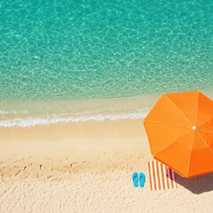 Naklejka premium Aerial view of beach with orange umbrella towel and blue flip flops near turquoise water edge on a sunny day