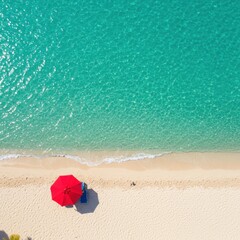 Naklejka premium Aerial view of a tropical beach with turquoise water and a red umbrella on the white sand shore
