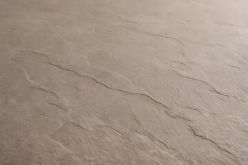 Obraz premium A close-up texture of a beige surface with natural variations and cracks, resembling stone or slate material