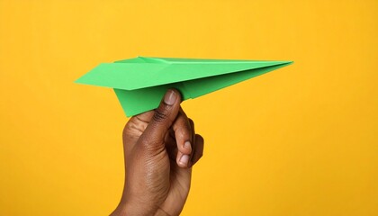 hand holding a paper airplane